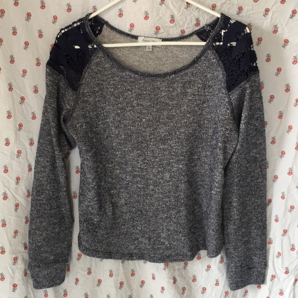 Blue sweater with lace shoulders